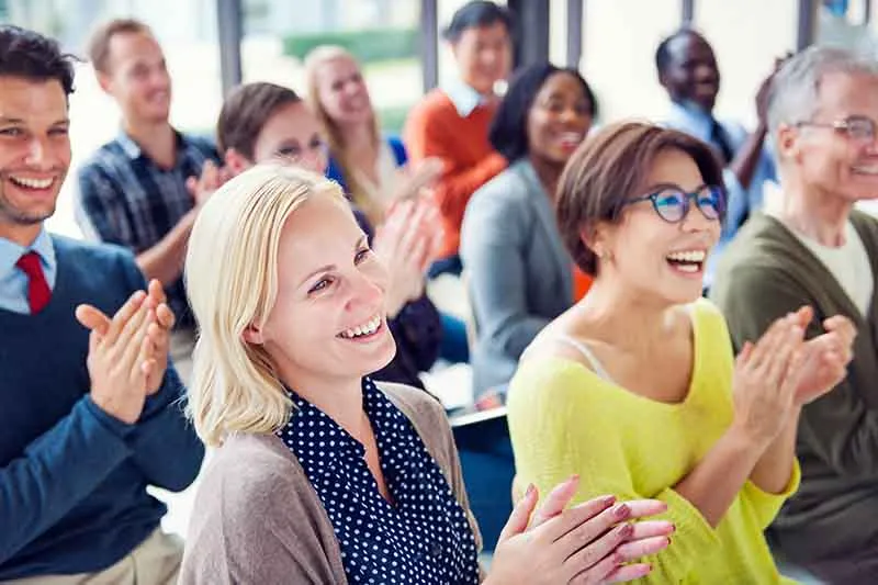 Group of people in customer success conference 