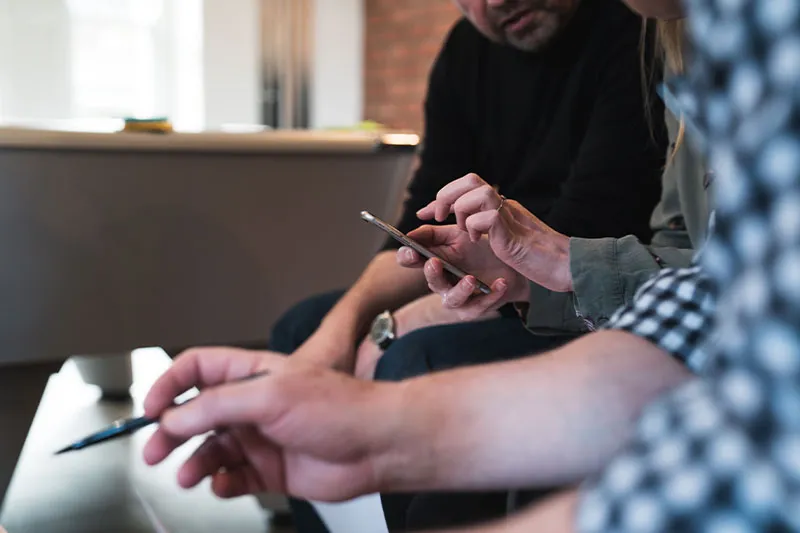 people working together using a smartphone