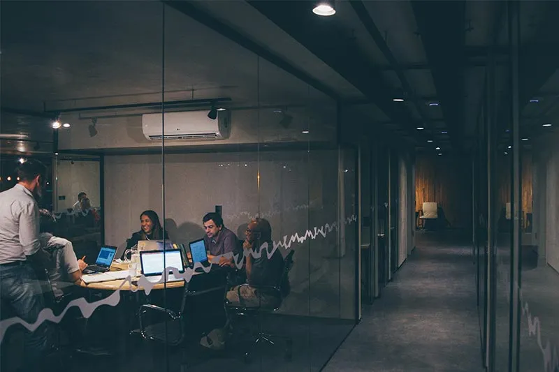 people working in a modern shared office space