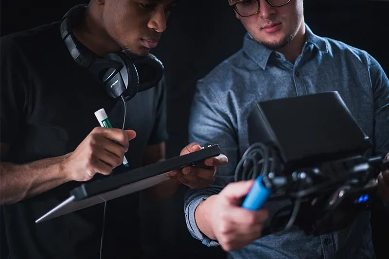 two men working on a project together 