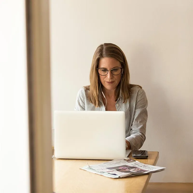 a female customer success manager working on her laptop