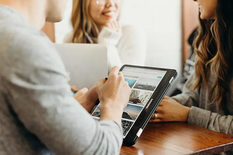 people working together with a tablet