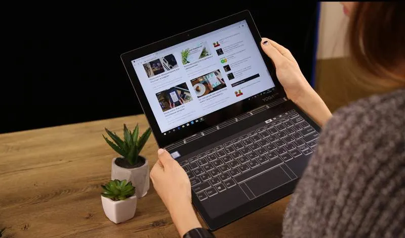 a person working on training material on a laptop