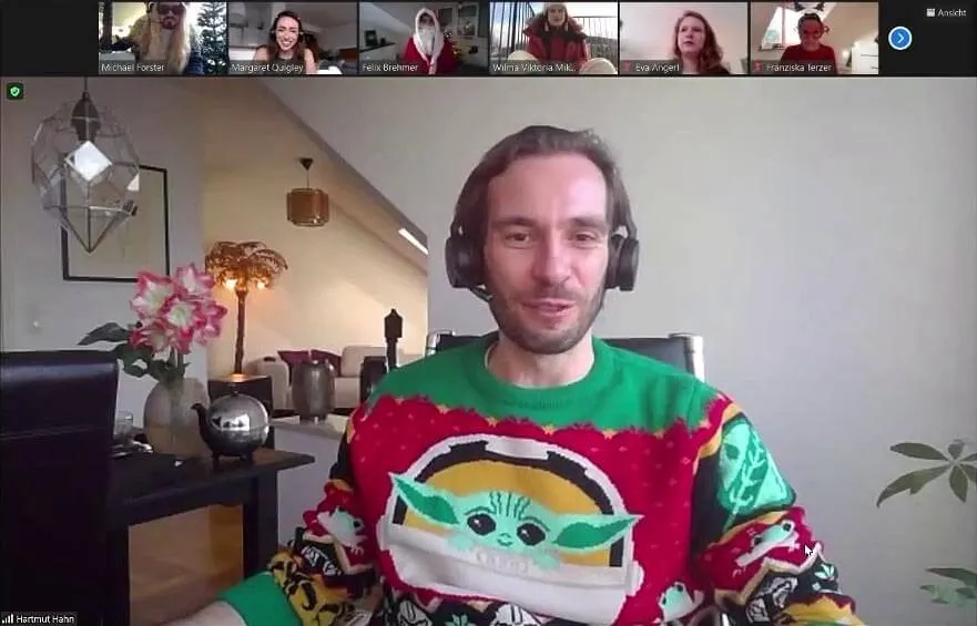 Userlane CEO and co-founder Hartmut Hahn in a Zoom call for Userlane's Christmas party wearing a Christmas sweater with Baby Yoda on the front.