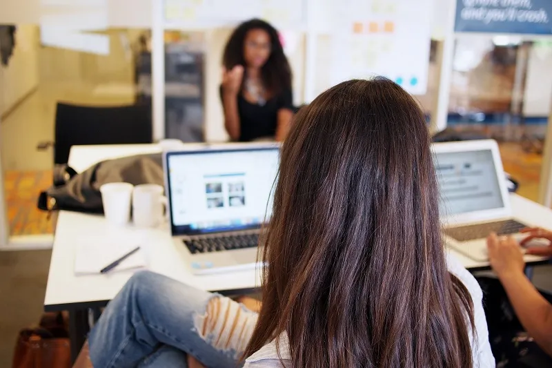 Woman sitting in front of her laptop partecipating in a user acceptance test