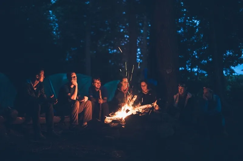 group of friends at a campfire