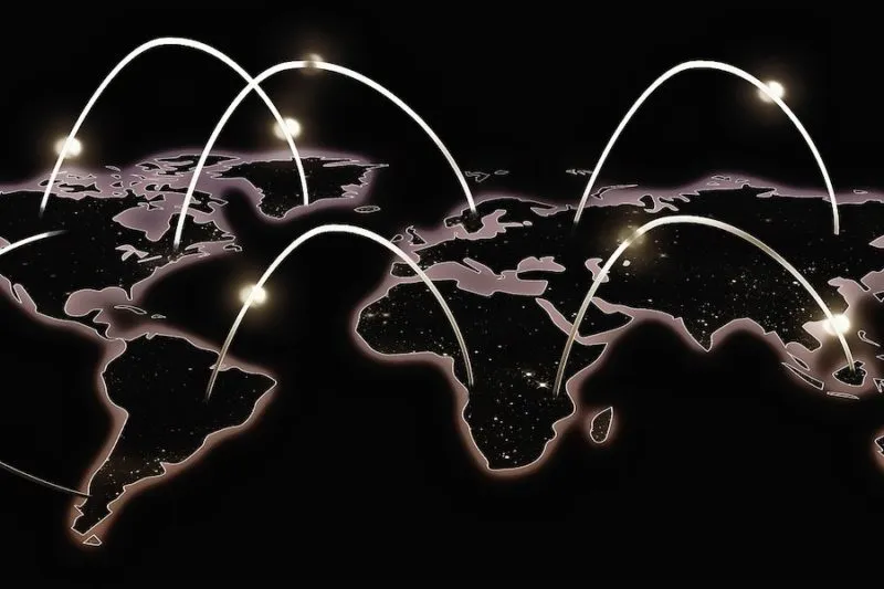 world map showing interconnected world with white beams going from one continent to the next 