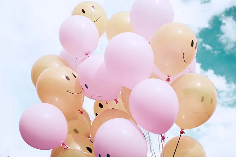 colored balloons with happy customers' faces