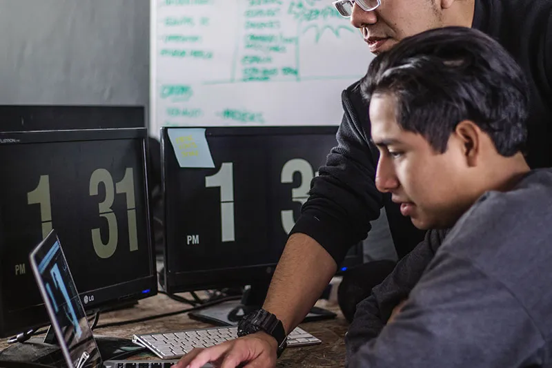 two men working on a project together