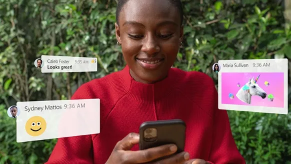 woman in red jersey using microsoft teams on her smartphone