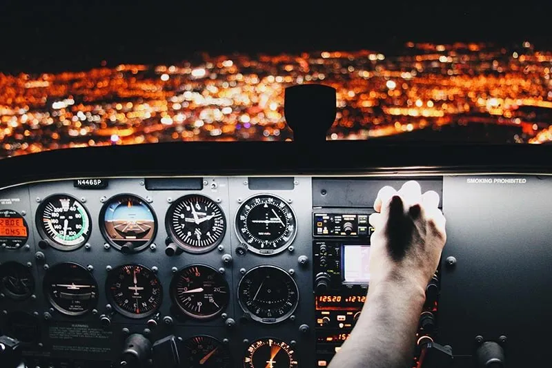 night view of city from the cockpit of a plane