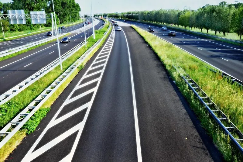 cars passing by on a highway