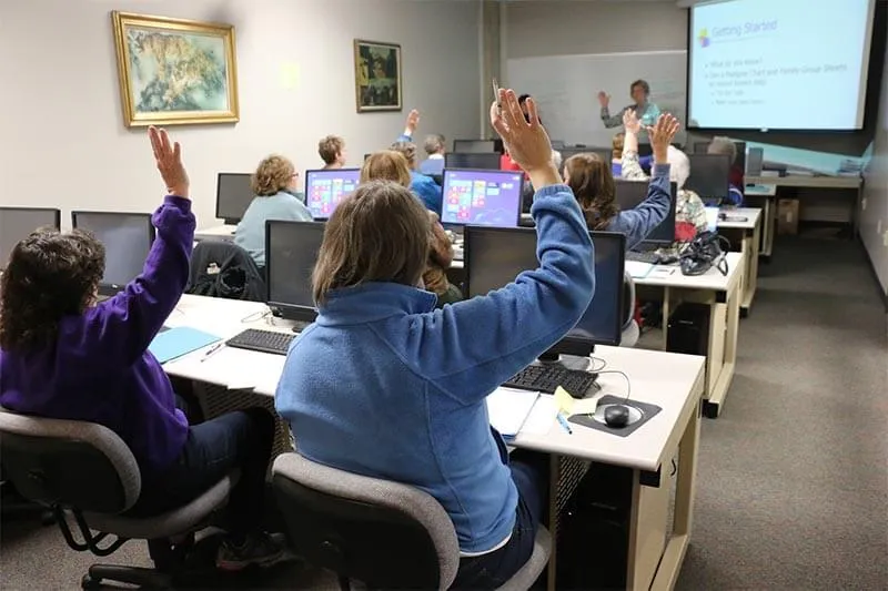 people in a software training room