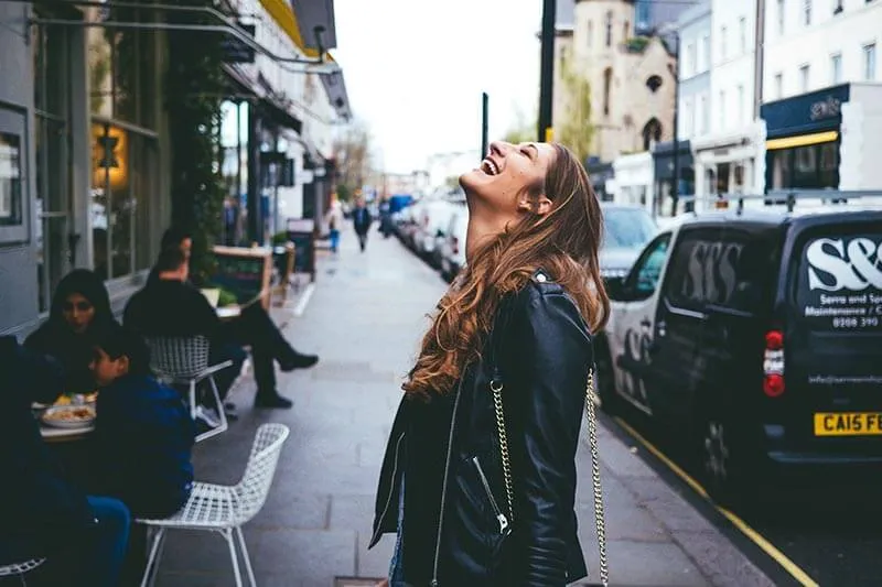 a happy girl on the street