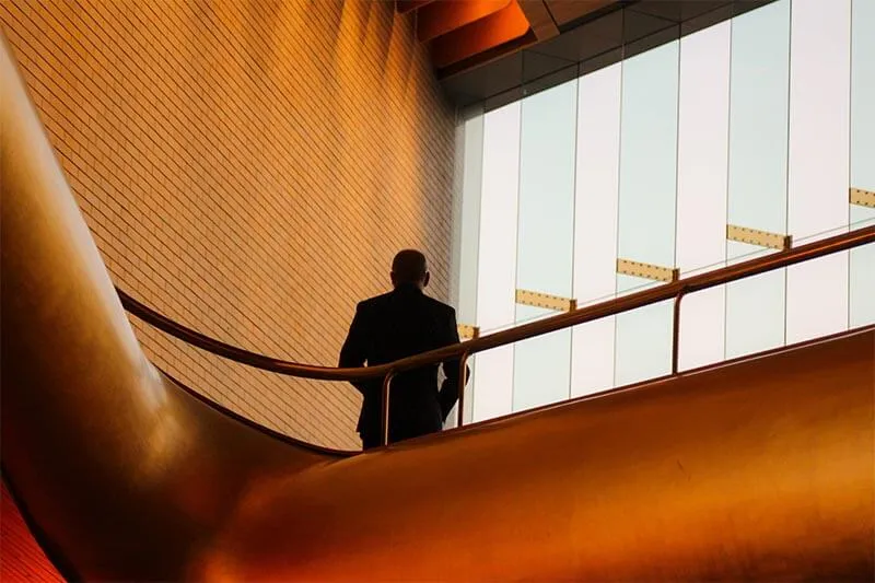 a man standing alone on the stairs