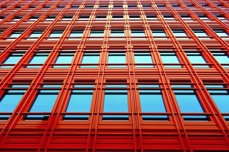 a red building with blue glass panes