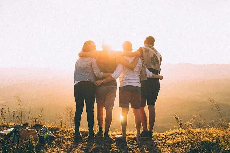 friends celebrating success while hiking