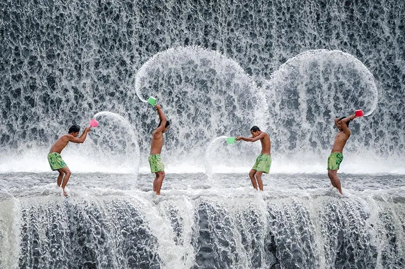 group of men playing with water