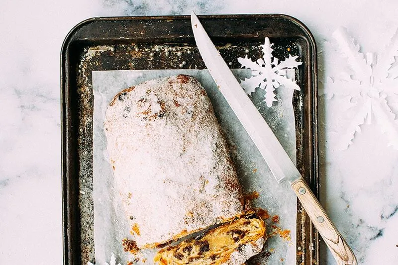 sweet bread on a tray with a steal knife