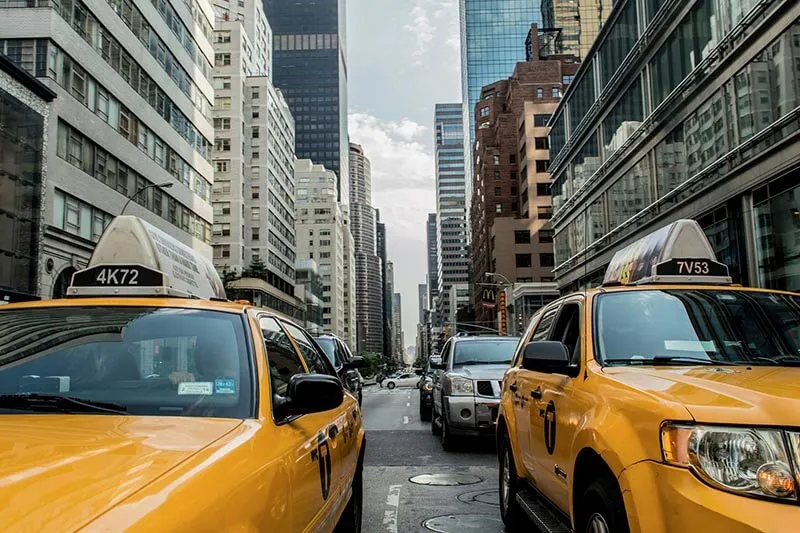 yellow taxis on city street