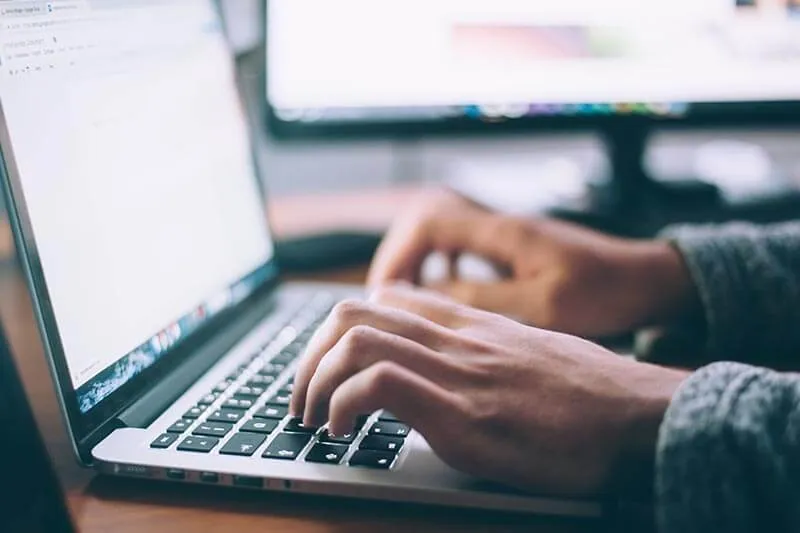 customer success executive at work on his laptop