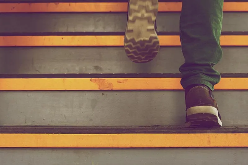 a man walking up the stairs