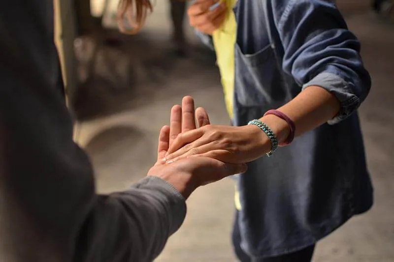two persons shaking hands
