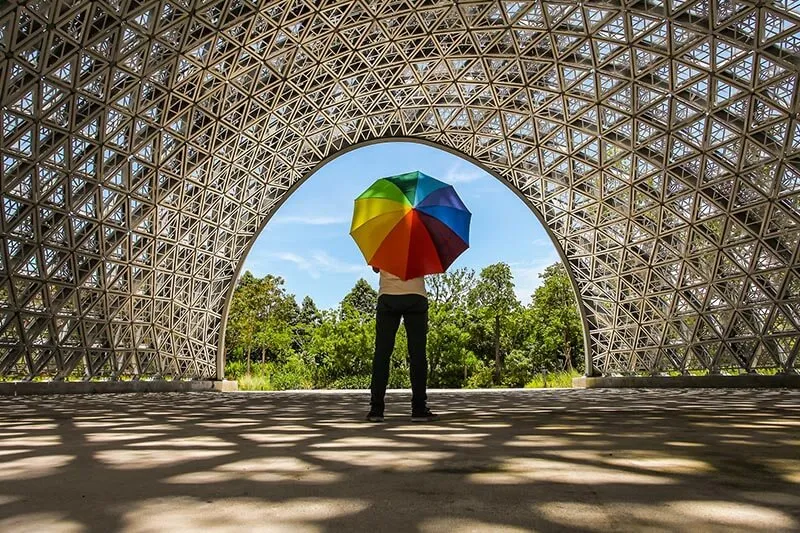 a man with a colourful umbrella 