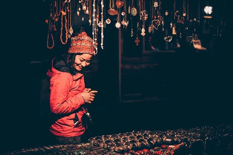 a happy asian girl at a shop