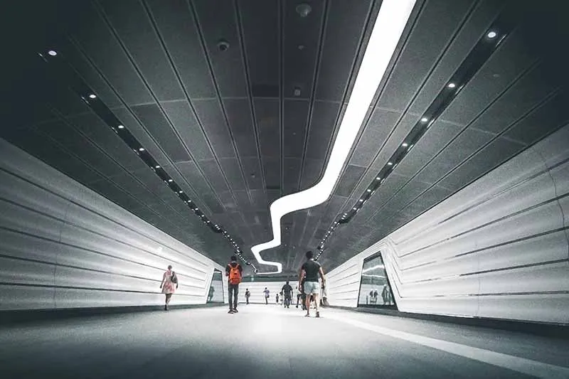 people walking along a corridor