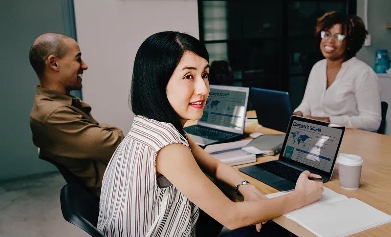 business people working at their laptops while in a meeting